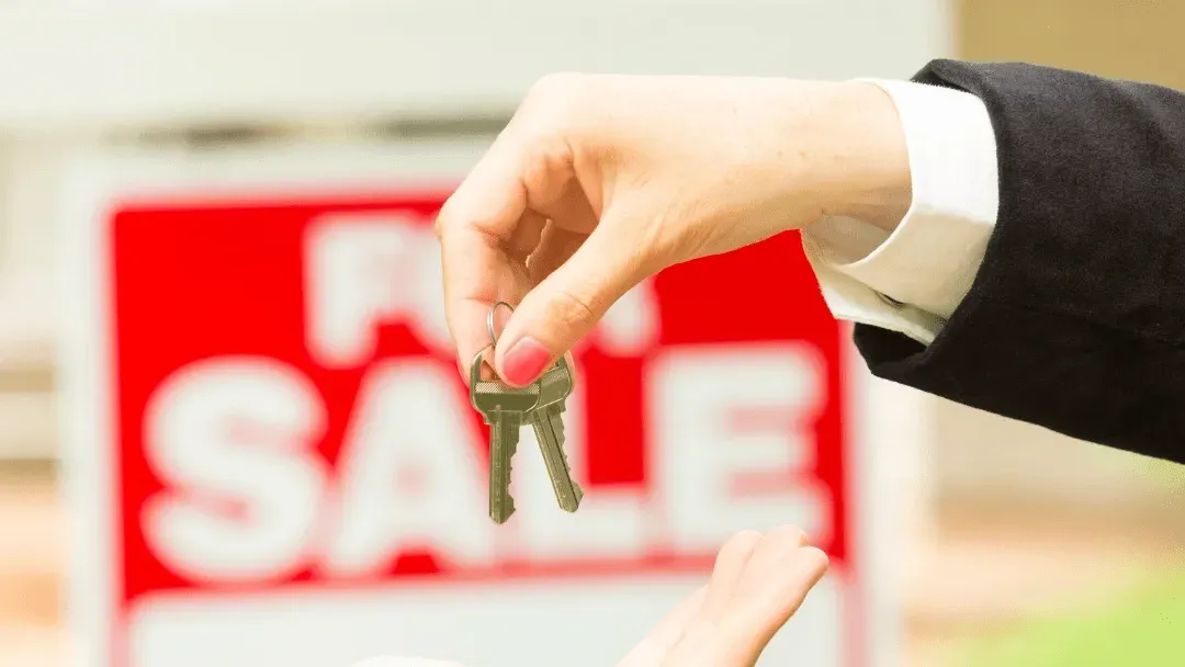 Happy homeowners discussing their moving home mortgage with an advisor